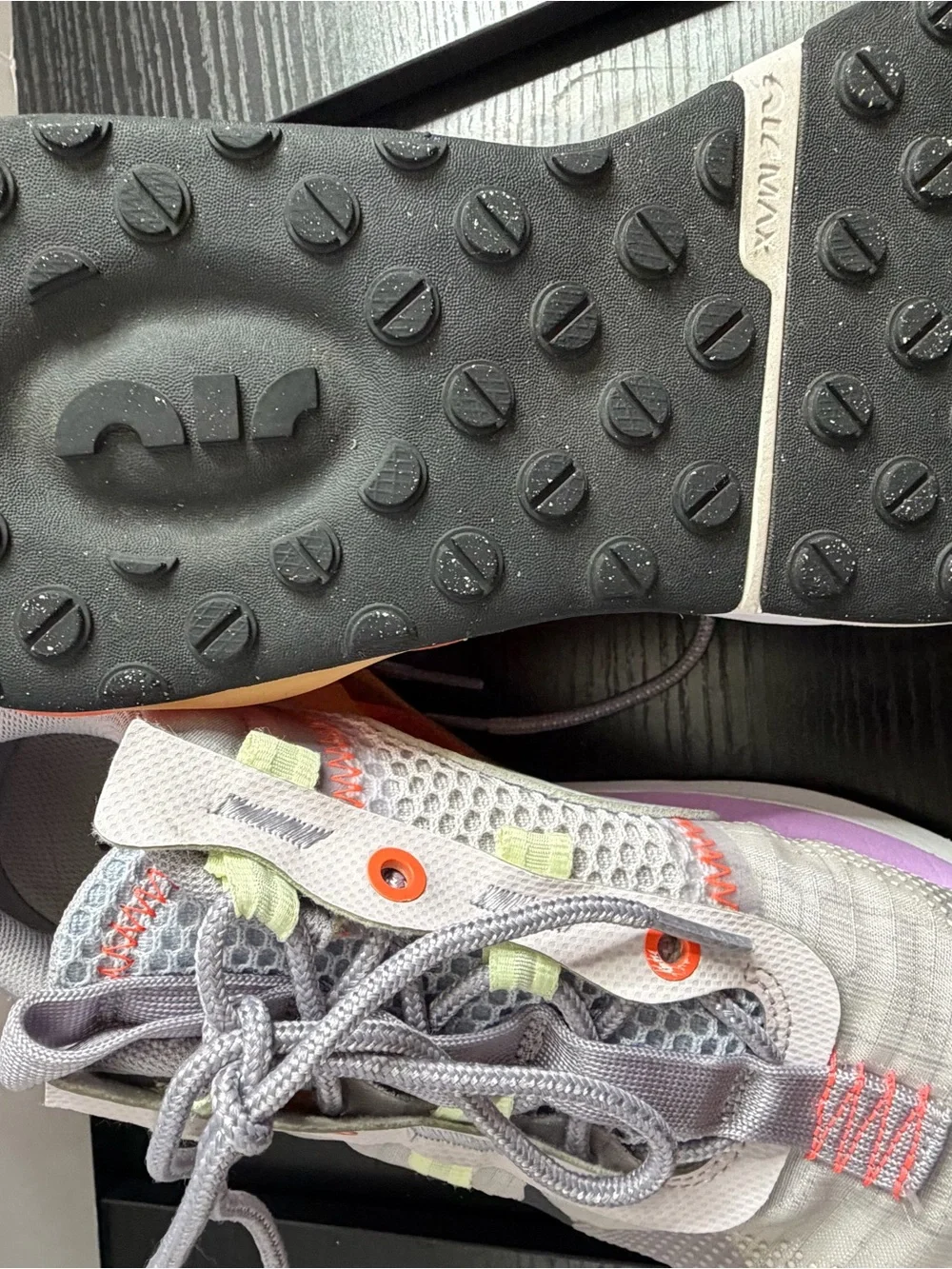 Nike Grey Athletic Sneakers with Black Swoosh and Orange Accents